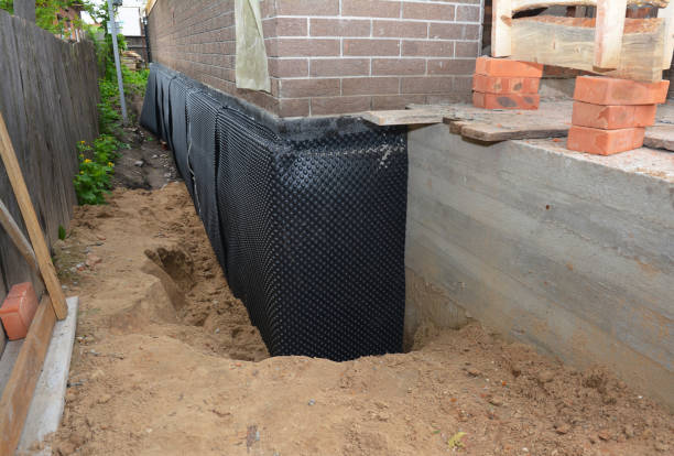 Happy homeowners after waterproofing job in Spencerport